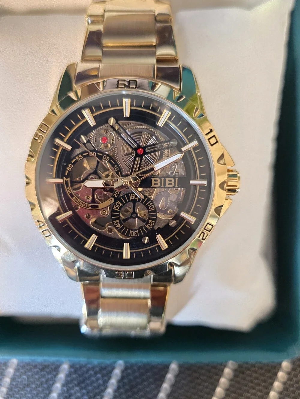 BiBi Gold Tone Skeleton Dial Watch with Black Accents